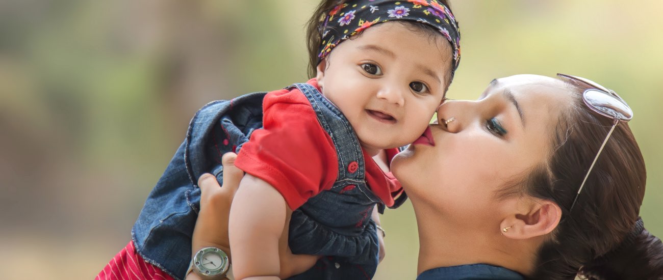 Image of mom holding her baby